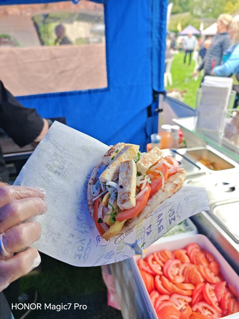 Authentic Greek chicken gyro wrapped in warm pita bread with fresh Mediterranean ingredients.